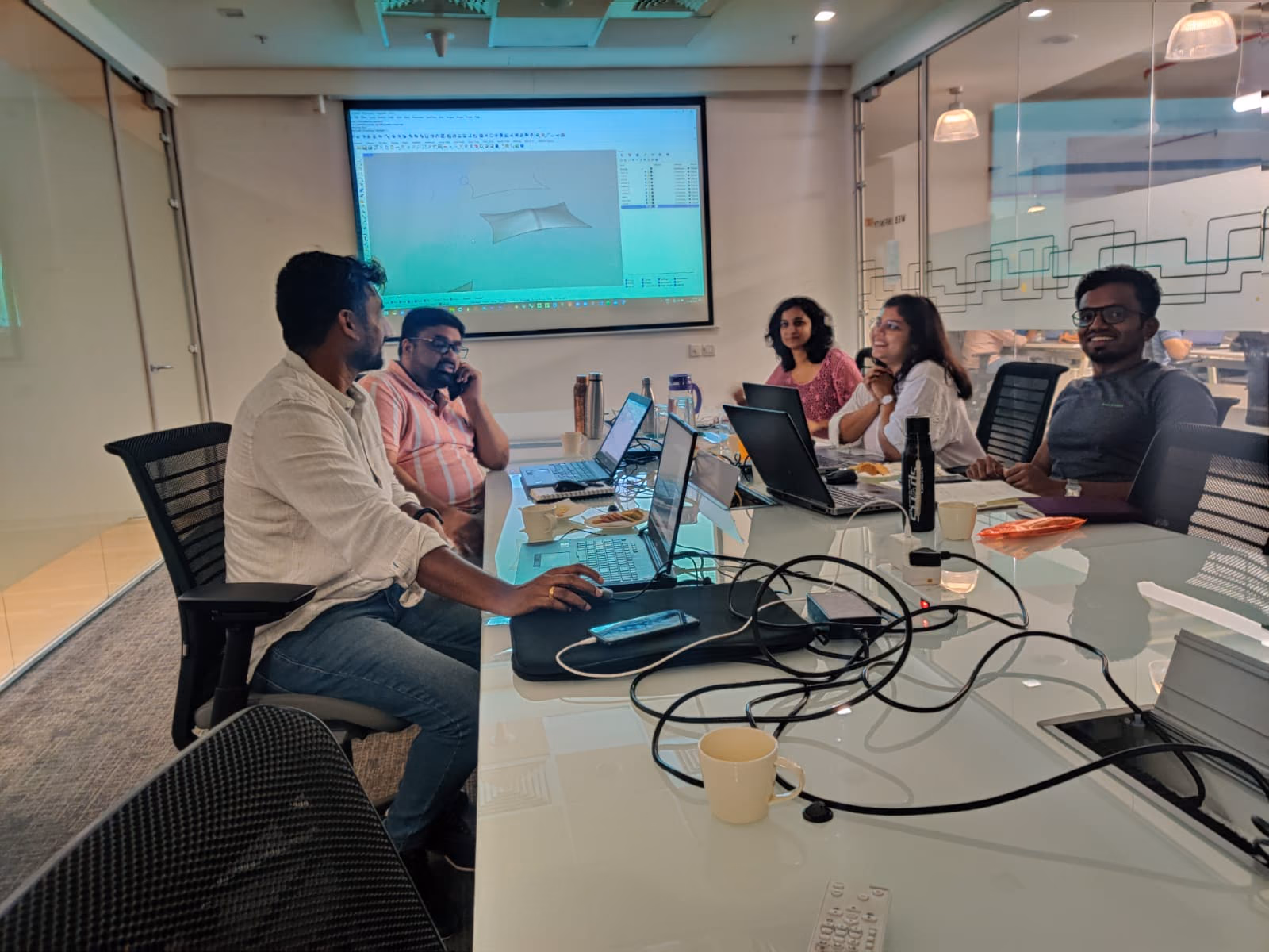 Trainer working through software on screen with a seated group